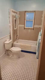 Laid And Grouted Floor Tile And Roughed In Wainscoting